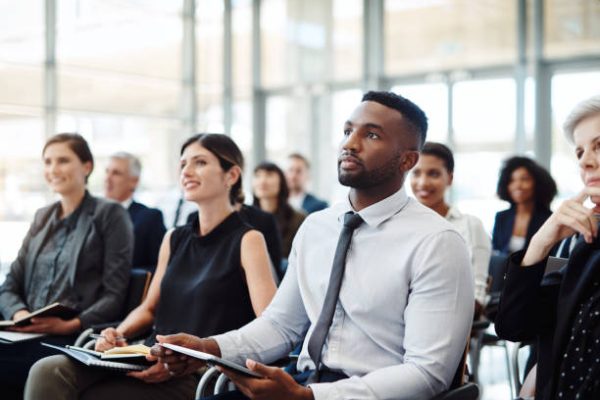 Shot of a group of businesspeople attending a conference